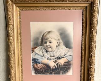 Ornately framed photograph of Child 1884!
