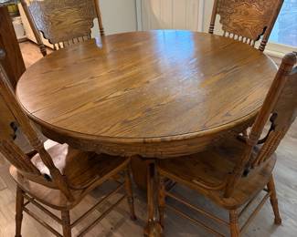 Solid Oak Round Dining table with four chairs