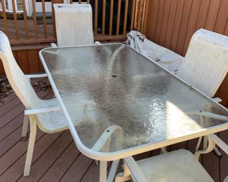 #54	case aluminum table 4 chair s with umbrellaglass table as is seat 66x40x28	 $75.00 
