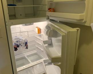 #14	ge freezer top metal shelves ge 16 frig  almond color	 $100.00 
