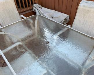 #54	case aluminum table 4 chair s with umbrella glass table as is seat 66x40x28	 $75.00 
