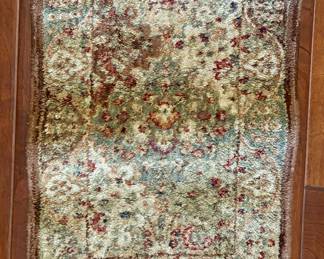 28. Shaw Tan, Green and Red Rug (33" x 23") 
