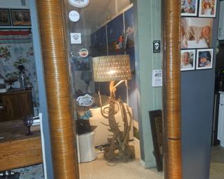Also in my living room is this 8 ft tall by 4 ft wide mirror that's wrapped in bamboo. Several of the strips are missing but it gets the job done. Only $250