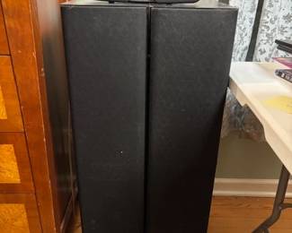 Klipsch speaker set including two towers, with a center and back speaker.