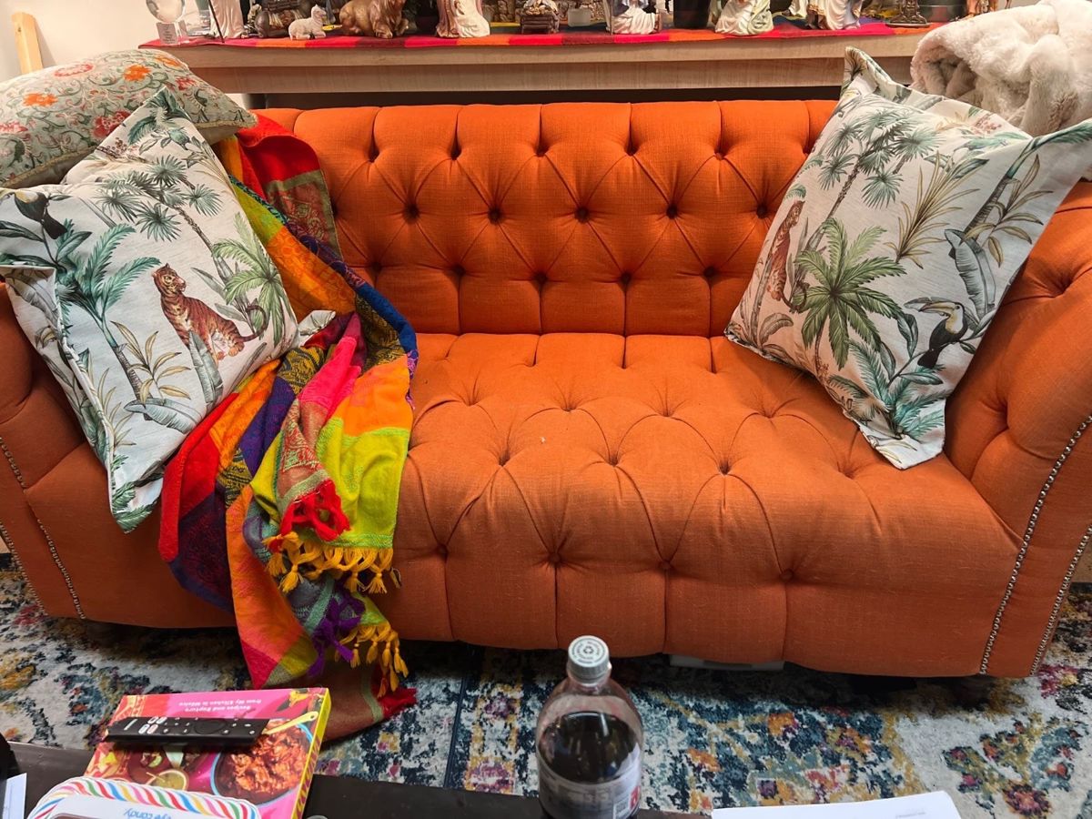 Tufted burnt orange couch