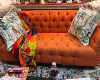Tufted burnt orange couch
