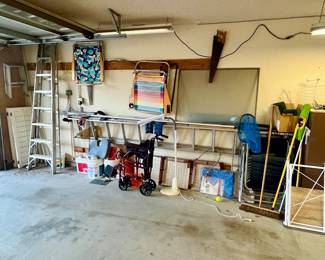 One side of garage. 4 ladders