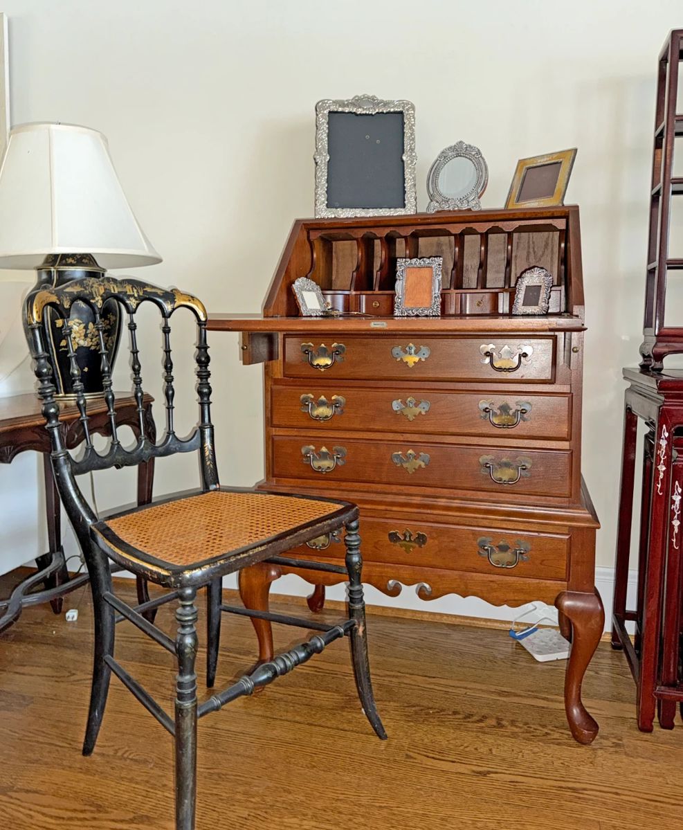 Chippendale-style slant-front desk, continuous bow-arm Windsor armchair with a cane seat