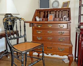 Chippendale-style slant-front desk, continuous bow-arm Windsor armchair with a cane seat