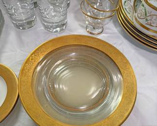 Vintage clear glass plates with a distinctive gold-encrusted rim, specifically identified as the "Rambler Rose" pattern by Tiffin-Franciscan