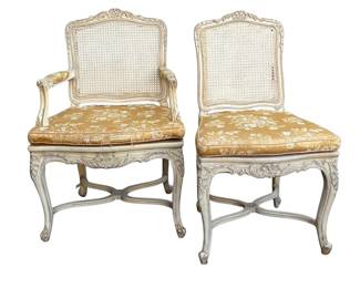 A very good set of 8 painted French style chairs with silk seat cushions