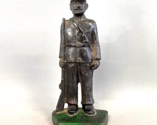 Cast iron soldier figurine door stop