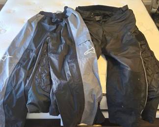 Pair Of Tour Master Motorcycle Pants And Pair Of Alpine Stars Rain Pants
