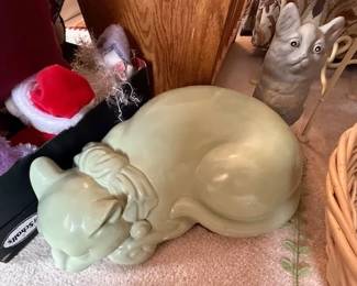 Lots of cat figurines. https://modestlambestatesales.hibid.com/