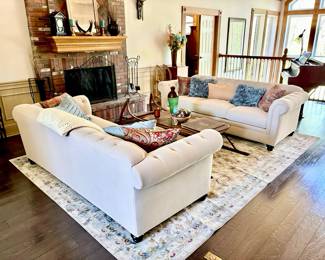 White Tufted Sofas, Area Rug, and Home Decor ( Coffee Table Not For Sale )