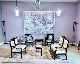 Antique Settees, Large Map, Area Rug, Antique Armchairs, Tables and Floor Lamps