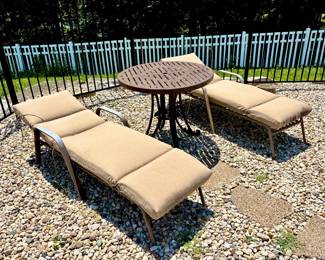 Outdoor Chaise Lounge Chairs and Cast Iron Table ( Located in building #2 on the property)