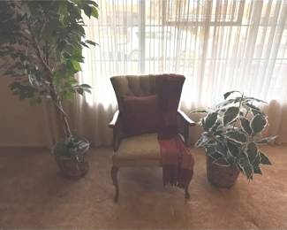 A Chair And A Couple Faux Plants