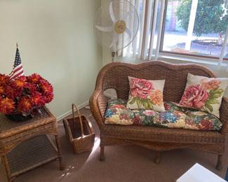 Outdoor Love Seat, Outdoor End Table, Wicker Basket, Standing Oscillating Fan, Faux Plant