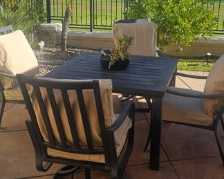 Table and chair set with cushions