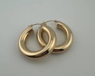 One of two pairs 14k gold hoop earrings