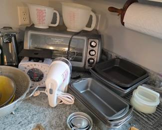 Toaster oven, Tupperware hamburger press, Hand mixer, Plastic measuring cups, Pastry blender, Can opener