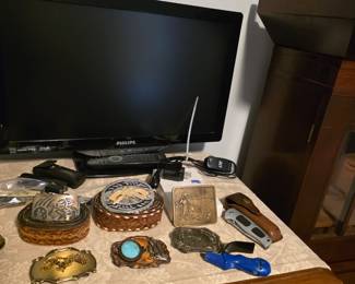 Belt buckles, knives, Phillips tv