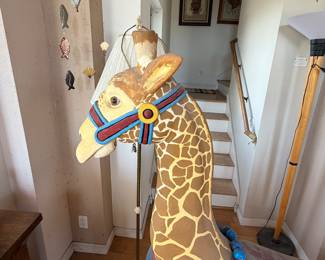 large decorative carousel-style giraffe figure