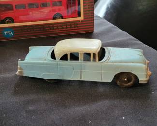 vintage Tootsietoy 1956 Packard sedan, specifically the two-toned blue and white model. 