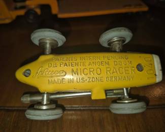 Schuco Micro Racer 1040, a vintage German die-cast toy car often modeled after Formula 1 Ferrari racing cars. 
