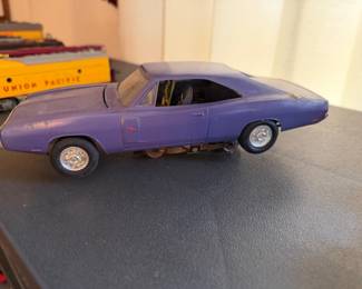 vintage slot car, likely an Aurora HO scale model of a Dodge Charger. 