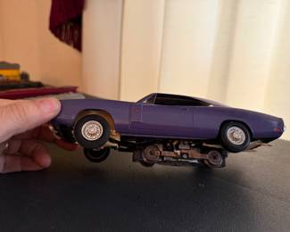 vintage slot car, likely an Aurora HO scale model of a Dodge Charger. 