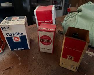 ACDelco PF20 oil filter & vintage box for Niehoff ignition parts & Delco Remy ignition coil from the 1940s-1960s, typically packaged in a red and black tin box.  