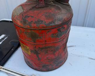 vintage red metal safety gasoline can