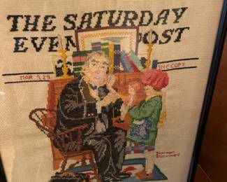 This is a framed, handmade needlepoint or cross-stitch depiction of the Norman Rockwell illustration "Tender Care," originally a cover for The Saturday Evening Post on March 9, 1929. 
