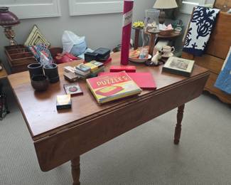 Primitive pine drop leaf dining table; puzzles & games