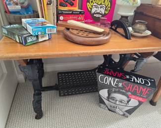 vintage games & books, side table made of antique sewing machine treadle base, antique kerosene lamp