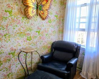 Great navy recliner and ottoman, butterfly  wall art, brass plant stand