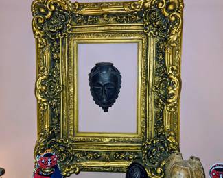 Thick gold frame, african mask