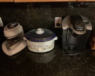 Some kitchen appliances- Presto Pizza Oven, West Bend Crock Pot, Keurig