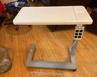 Used as a serving tray / table under a hospital bed.
