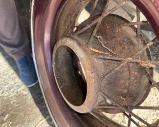 No this wheel isn't for the Subaru!  Probably from the 30's, maybe Ford?