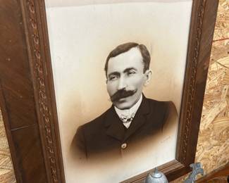 Ancestor photo in well-carved frame