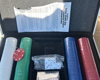 New cards, chip, and dice set in a metal carrying case 