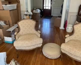 Pair of  vintage upholstered chairs with matching “Pouf”.  