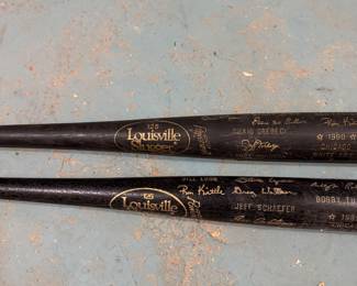 Louisville Slugger Model 125 black baseball bats featuring printed player signatures, Chicago White Sox, circa late 1980s–1990s). Decorative / collectible, $250 for the pair