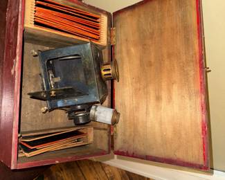 Victorian-era magic lantern / lantern slide projector housed in a red wooden case, 19th–early 20th century, Untested, $390