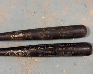 Louisville Slugger Model 125 black baseball bats featuring printed player signatures, Chicago White Sox, circa late 1980s–1990s). Decorative / collectible, $250 for the pair