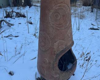 Clay Chiminea, traditional wood-burning outdoor fireplace, "potbelly" shape w/ textured swirl. Terracotta (baked clay) w/ Iron base. Price: $195 Height estimate 36" to 42" (including stand) Width 16" to 20" at the widest part of the bowl estimated Weight 60 – 70 lbs Fuel: Wood or Charcoal (Best used with small logs/kindling)