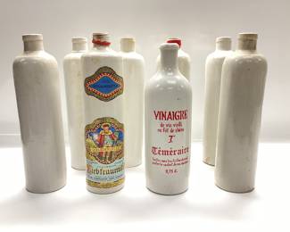8 VINTAGE WINE, SPIRTS AND VINEGAR STONEWARE BOTTLES SOME ARE FROM GERMANY FROM THE LATE 70â€™s AND 4 ARE JAMES R BEAM STONEWARE POTTERY